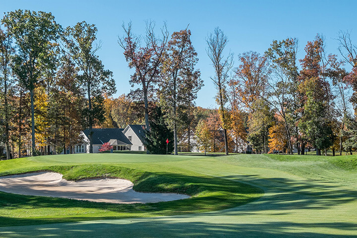 golf green with sand trap nearby