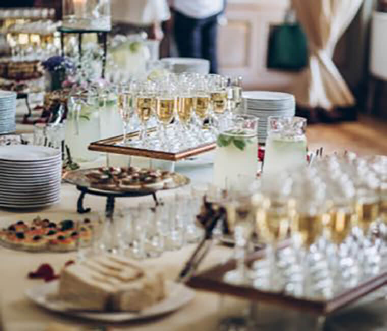 buffet table with trays of drinks